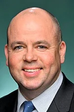 Portrait of Sam Birrell MP
